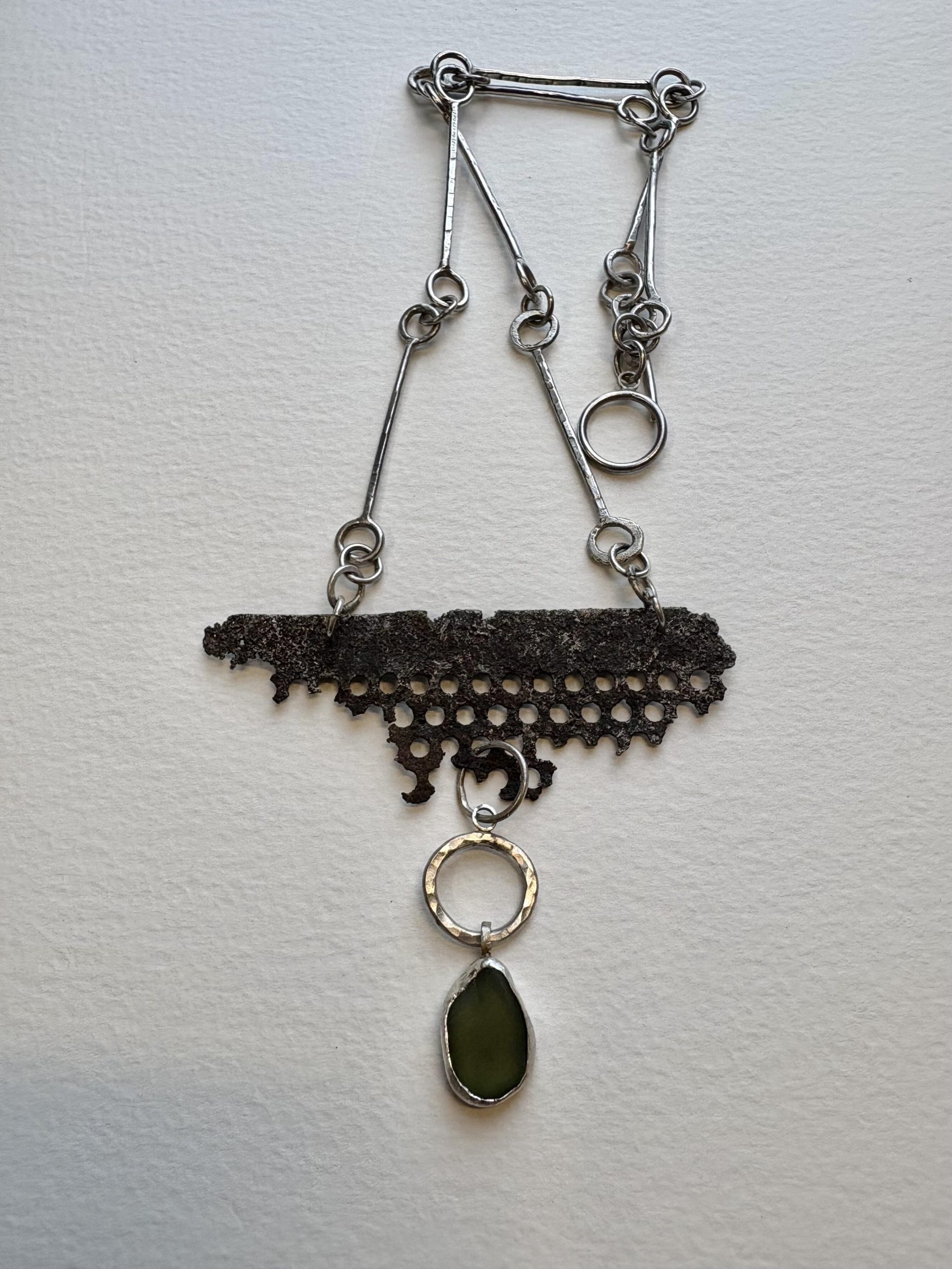 Jane Griffiths: Necklace of found metal and green seaglass on a handmade sterling silver chain