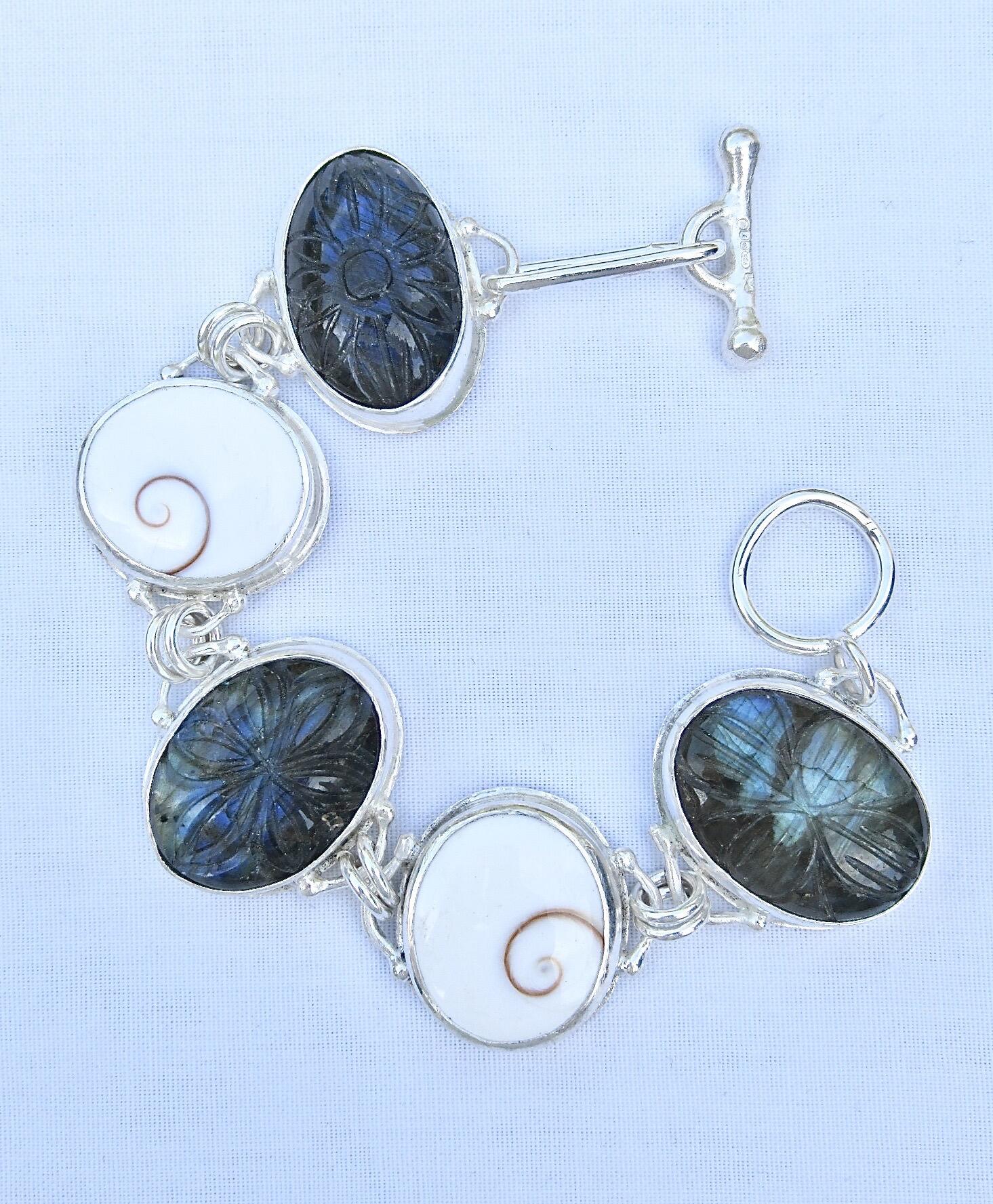 Tony Thomson: Tony Thomson Bracelet: carved labradorite & operculums set in silver with clasp