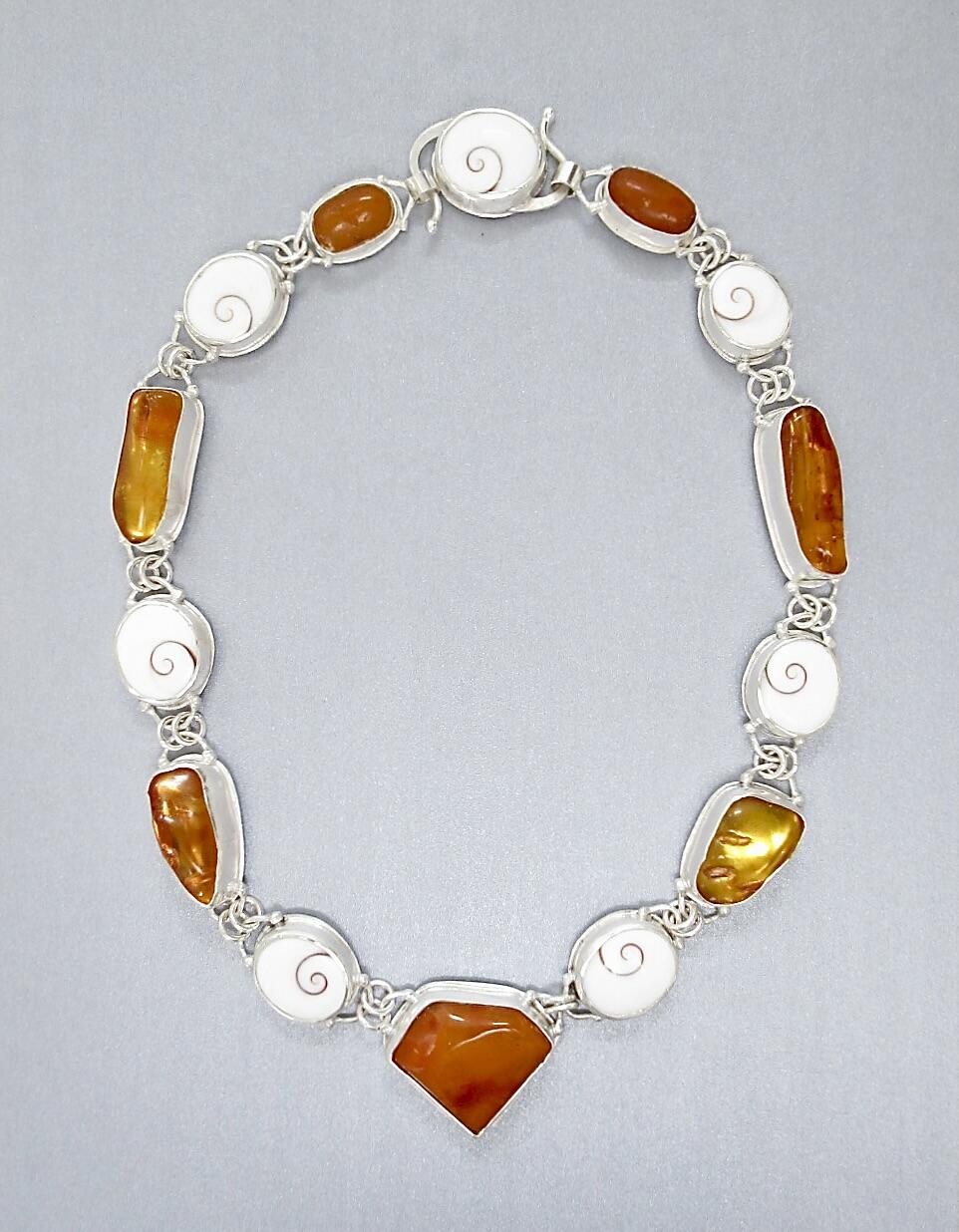 Tony Thomson: Tony Thomson Necklace: amber & operculum set in silver with silver clasp