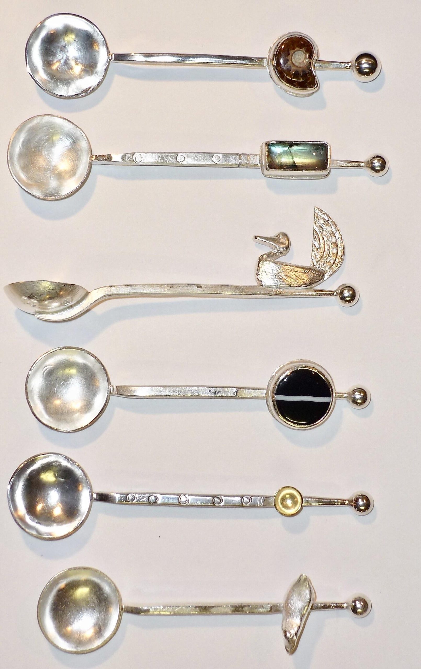 Tony Thomson: Tony Thomson Spoons: silver spoons with ammonite, abalone, duck, pebble, gold disc