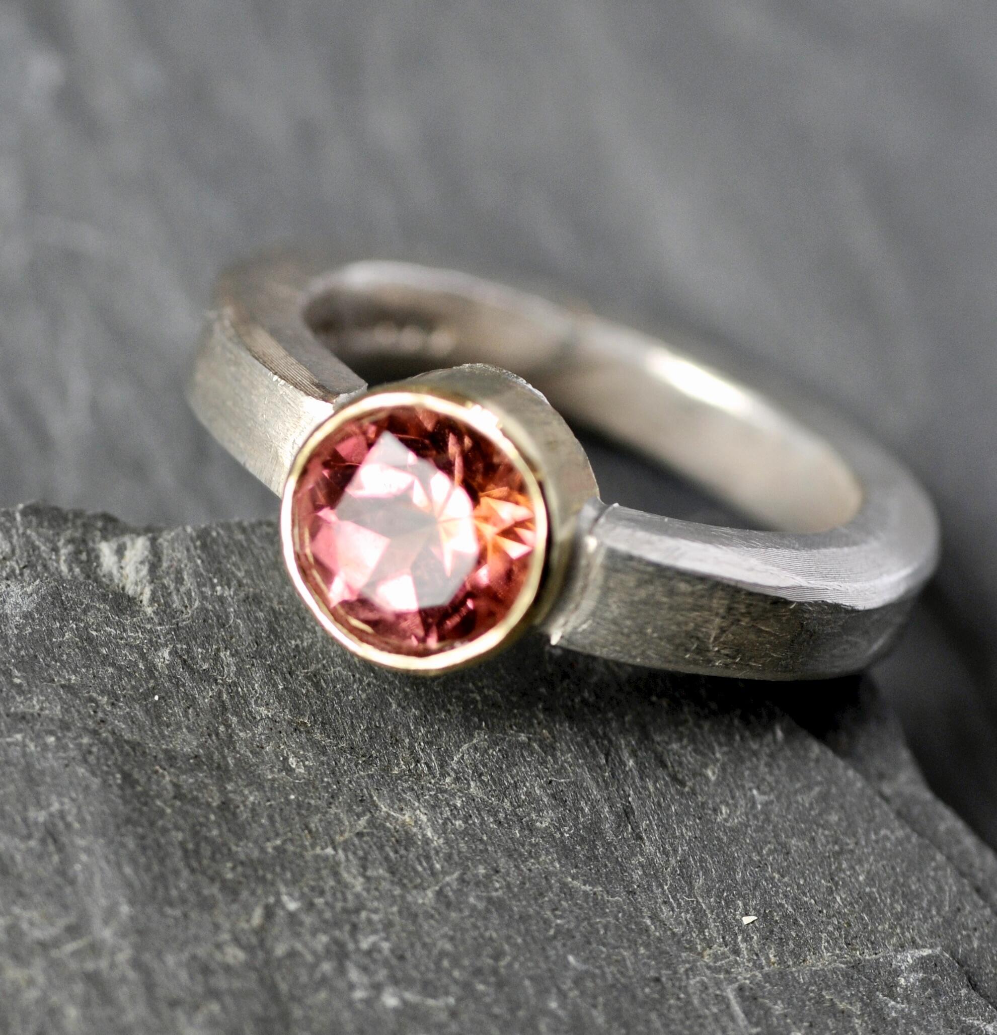 Tony Thomson: Tony Thomson Ring: tourmaline set in 18ct gold with silver band