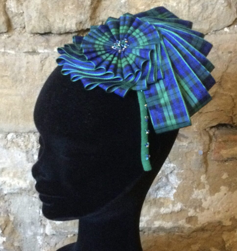 Tartan Nautilus Cockade on a beaded headband.