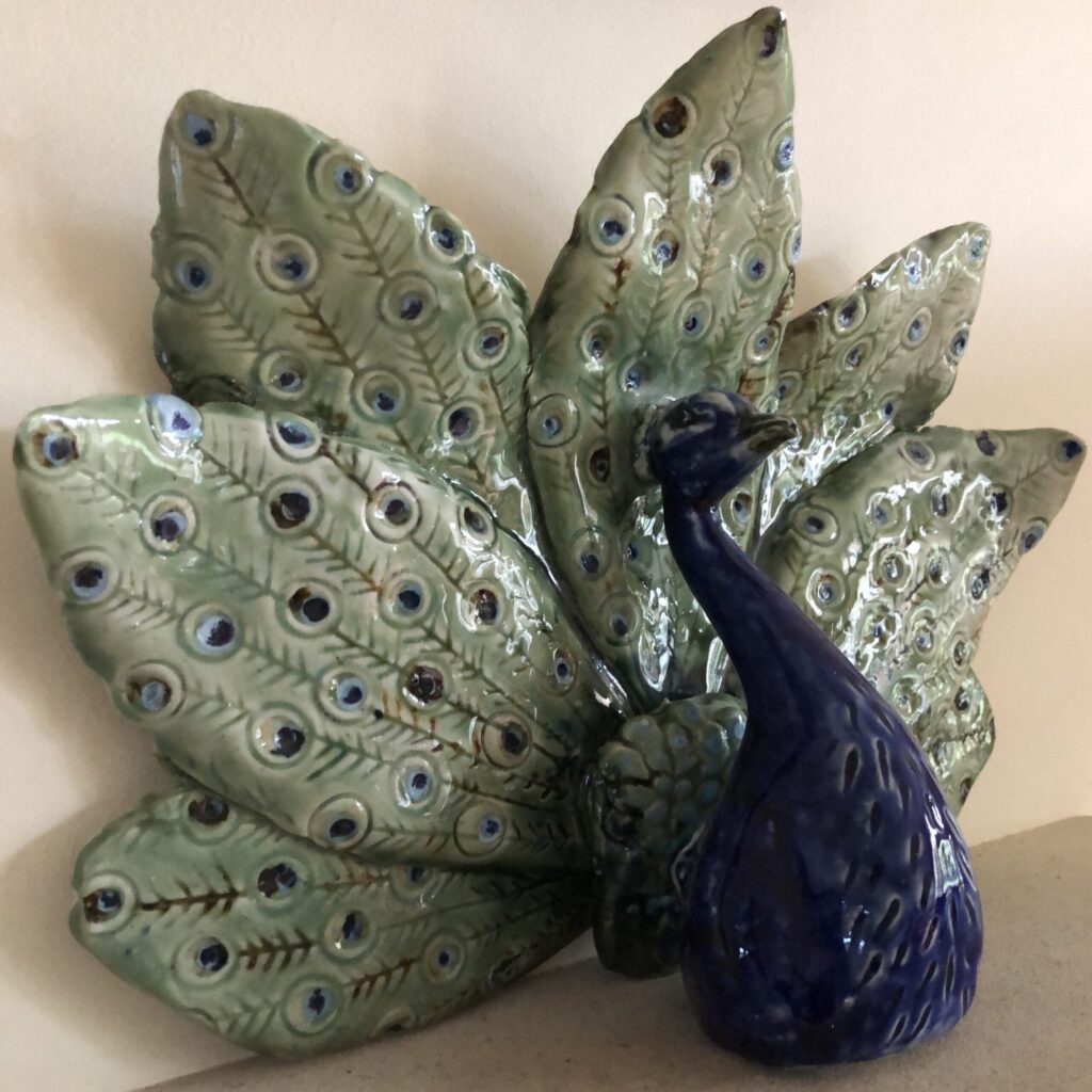 Peacock in full display, hand built and decorated to celebrate the majestic power of this bird.
