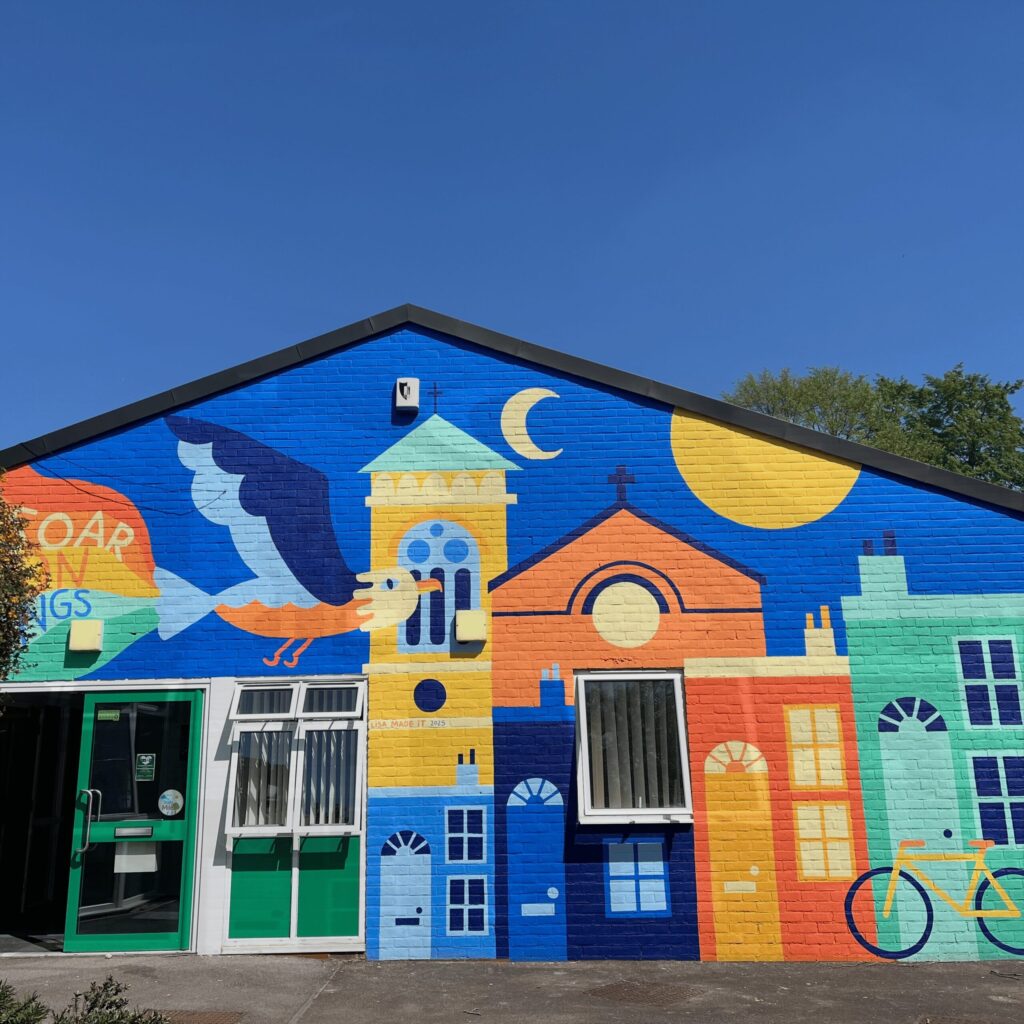 Photo of the mural at the entrance to St Barnabas School