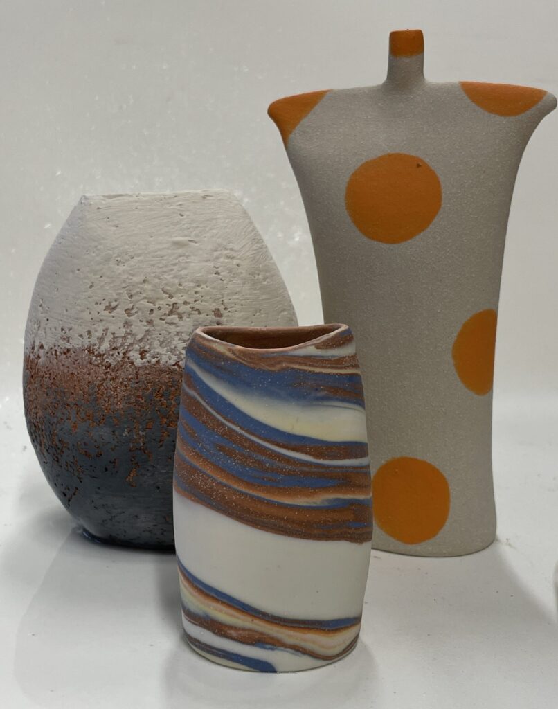 I design and make one off, hand crafted and decorative ceramic art, focusing on shapes, colours and surface textures.