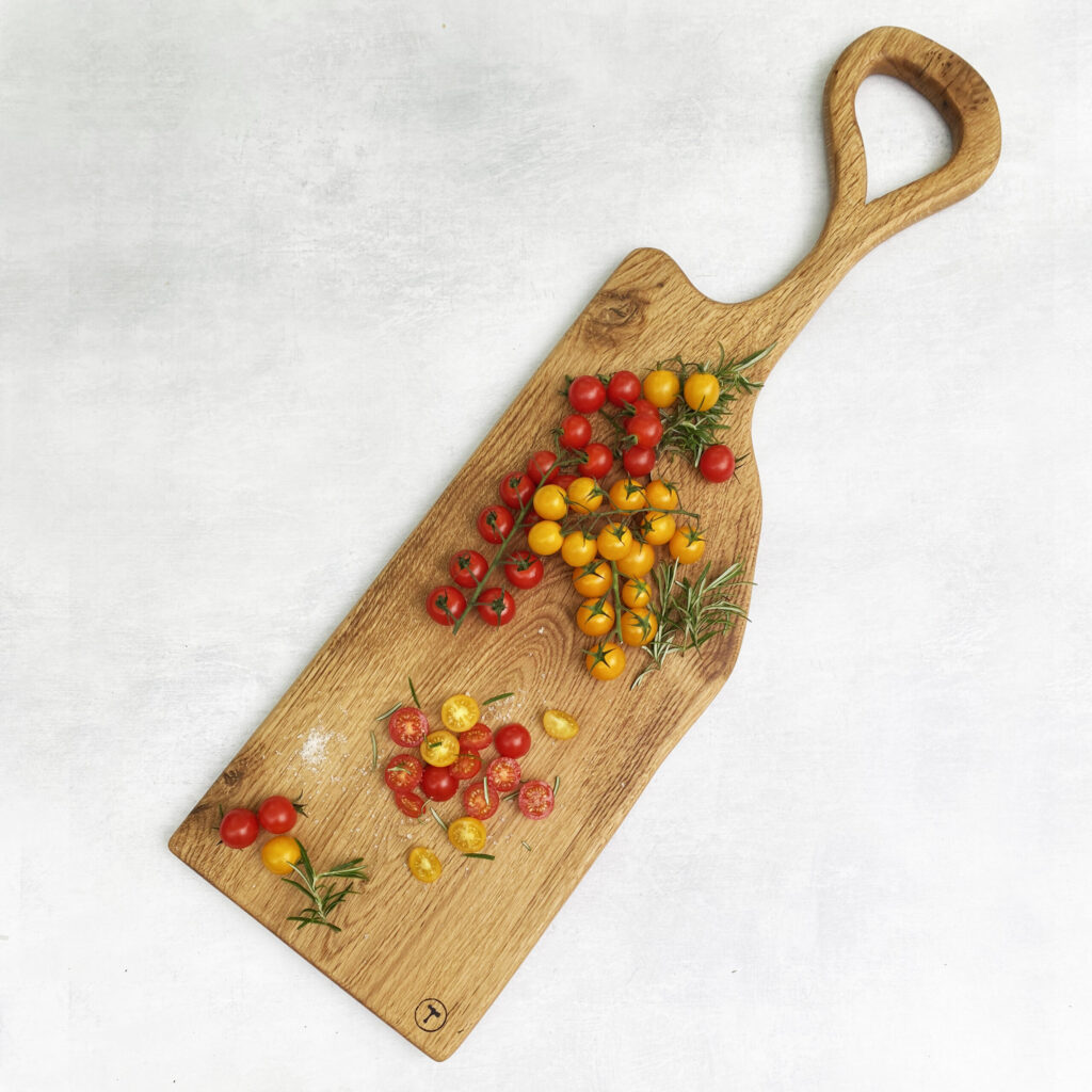 Large Oak serving board with cherry tomatoes