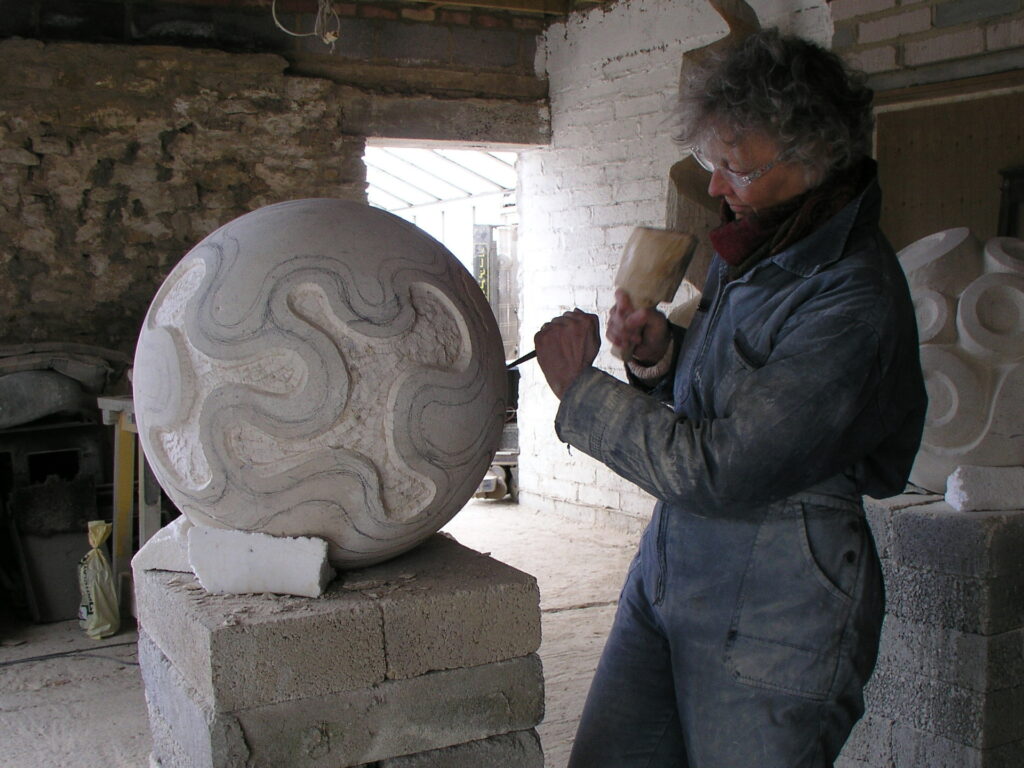 Carving one of the four stone finials at the entrance to Folly Park View