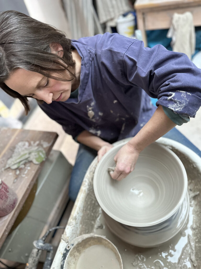 Helen Woolner throwing on the potter's wheel