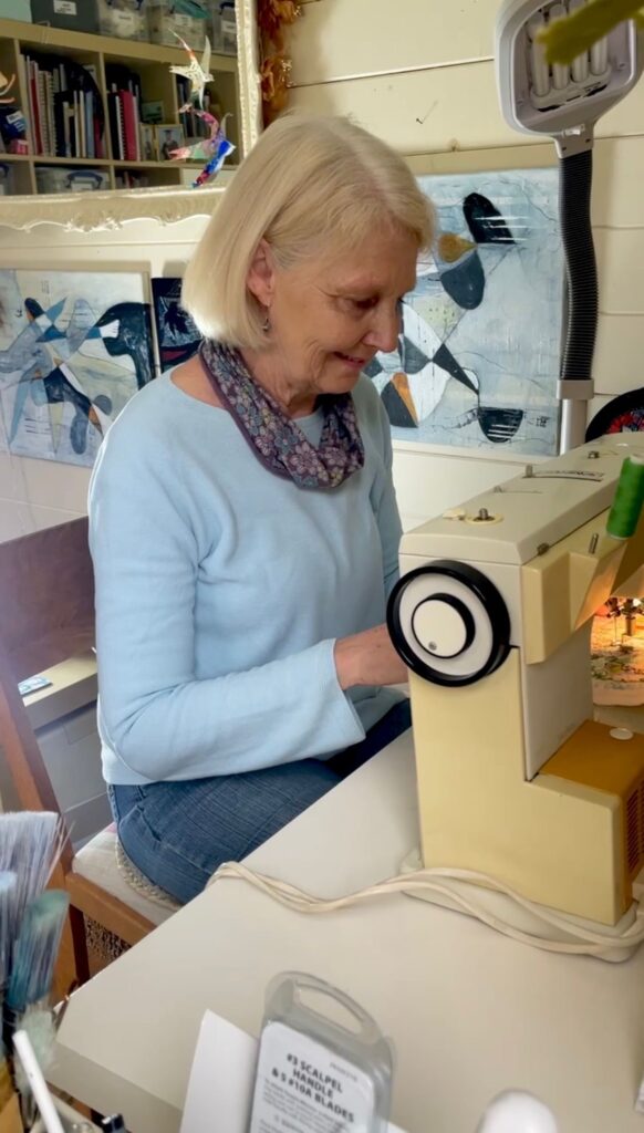 Stitching in my summerhouse studio.