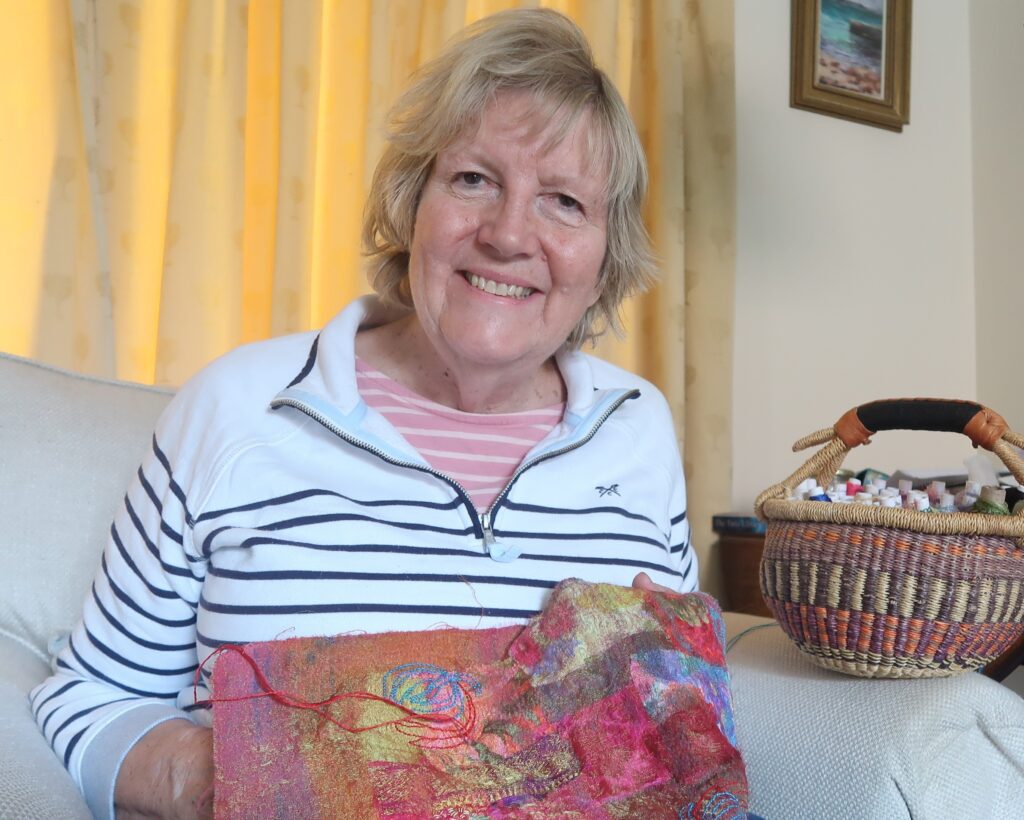 Ticia enjoying hand stitching