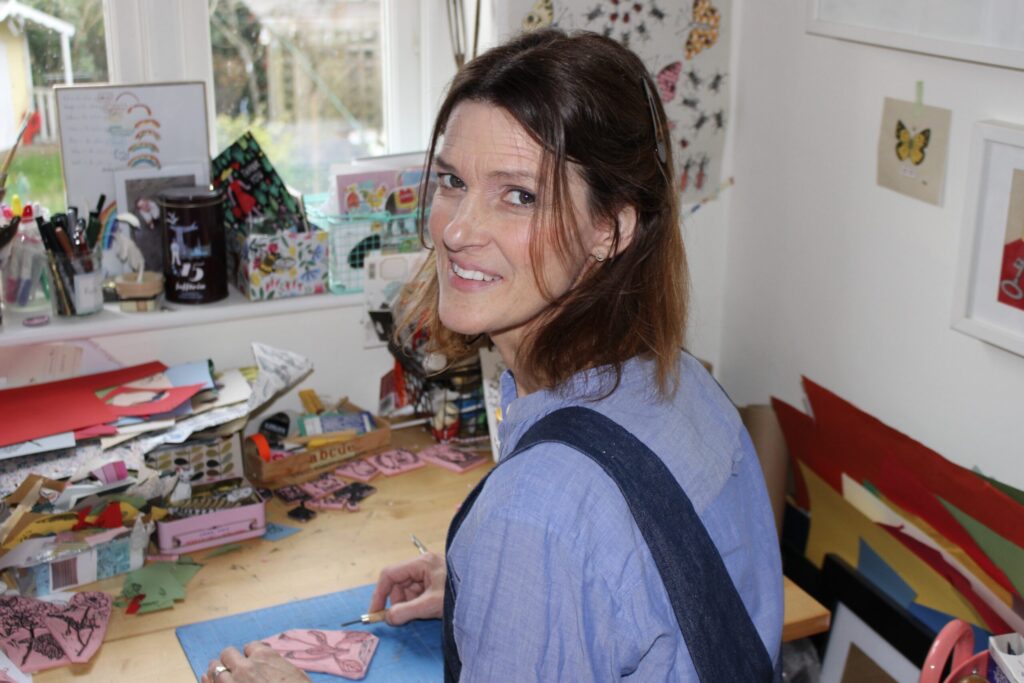 Lizzie Waterfield carving a rubber stamp