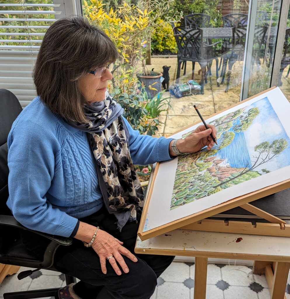 A photograph of Jane Peart at work in her studio