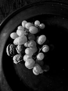 Helen C White: Grapes on pewter plate