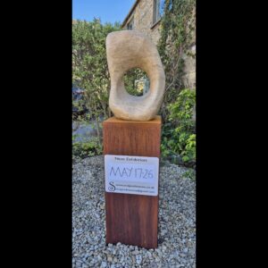 David Williams OAS, WOA: Mobius Form, Ancaster hard white limestone, rusted steel base.