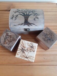 Sharon Rich WOA: Trinket boxes. Selection of pyrography and stained glass trinket boxes.