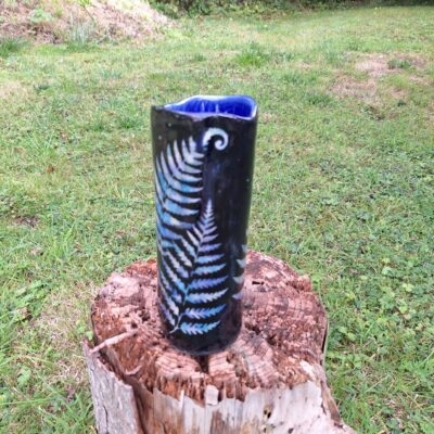 Pottery tall vase with ferns