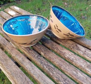 Alison Holmans: Bowls with fish swimming around a deep blue sea