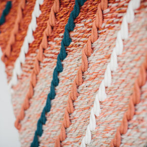Cassandra Smith: Detail of a handwoven wall-hanging featuring hand-manipulated cord