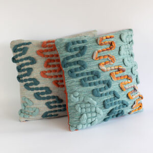 Cassandra Smith: Cascade cushions featuring handwoven wool, cotton and wool roving.