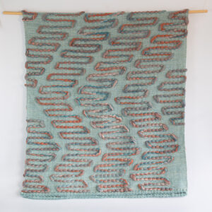 Cassandra Smith: Cascade handwoven throw featuring an intricate design of wool roving.