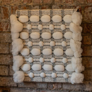 Cassandra Smith: ShadowForm II, textured handwoven acoustic wall panel featuring wool, cotton, linen, wire and paper yarn and wool roving fibres.