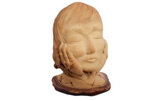 Haleh Walton: Hand-sculpted ceramic piece with intricate floral details etched into the hands and base