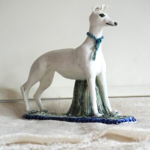 Philippa Norris WOA: Shall I shan't I run? Whippet cast in porcelain based on my own dog.