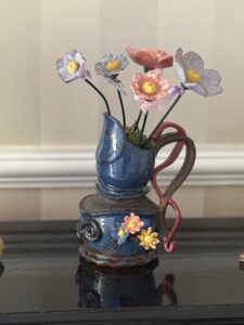 Carole Mockford: Hand made ceramic flowers to adorn your quirkiest flower holders. From £6 each. (the dancing jug is NFS)