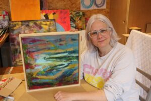 Victoria Kearney: Oxford abstract colourist artist showing framed finish painting on raw unprimed canvas. mixed media.
