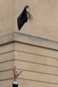 Fliss van Steenbergen: A graduate throws a mortarboard into the air