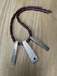 Joy Cecilia Taylor: Amethyst bead and silver necklace.