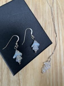 Joy Cecilia Taylor: Silver and moonstone earring and necklace set.