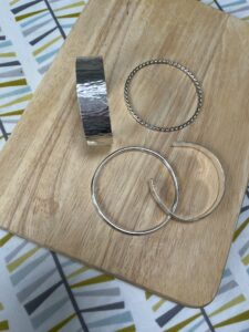 Joy Cecilia Taylor: Textured silver bracelets.