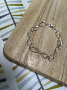 Joy Cecilia Taylor: Twisted chain silver bracelet.