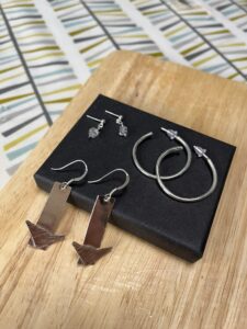 Joy Cecilia Taylor: Silver earrings.