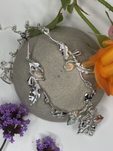Tsedey Roscoe: Necklace - Enchanted woodland theme made with sterling silver leaves, flowers and Ethiopian opals