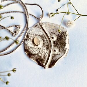 Tsedey Roscoe: Pendant - Textured sterling silver medallion with Ethiopian opal and two silver balls
