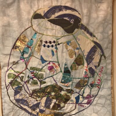 Double sided wall hanging with main design inspiration the shape of a reconstructed Roman storage jar.  Incorporates various techniques - appliqué, reverse appliqué goldwork technique, fabric decorated with sublimation printing and foiling, free motion embroidery, stencilling (2022/24)..