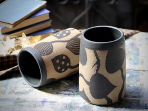 Leigh Hicks: Two stoneware vases, decorated with botanical sgraffito in black