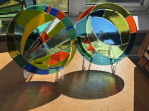 Kay Gibbons OAS, WOA: Fused glass rondels for display . Inspired by my painting ‘Spring Glass’ exhibited in the recent OAS members Exhibition in St John’s College Oxford