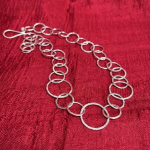 Alison Morris: Hand-hammered sterling silver necklace. 45cm long including clasp (adjustable length by hooking the clasp into any ring)