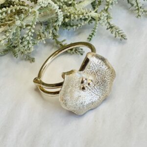 Tsedey Roscoe: Ring - Textured sterling silver lily pad with silver balls in the centre
