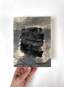 Josie Clouting: Sea Stack, charcoal, ink on wood, 15 x 20cm