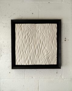 Theo Silkstone: Wall mounted jesmonite art made by Theo Silkstone with black oak frame