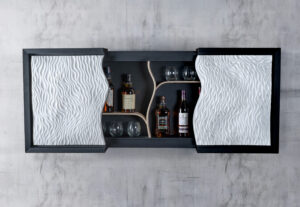 Theo Silkstone: A wall mounted modern drinks cabinet made by Theo Silkstone with jesmonite art front