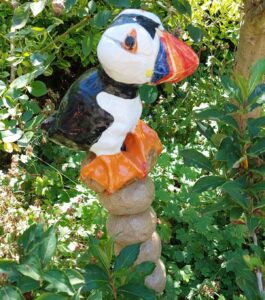 Alison Holmans: Lifesize puffin on ceramic stacking stones