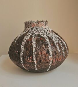 Kashmira Patel: Quiet Eruption - Black clay moon jar with volcanic effect