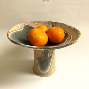 Sally Dorrity WOA: dish on tall foot, stoneware claym dry green glaze
