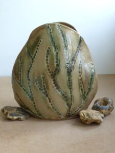 Fi Cooper: Vase with abstract inlaid seaweed design, coloured with green copper wash, handbuilt
