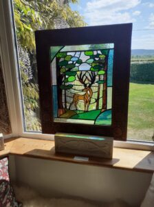 Sharon Rich WOA: "Stag in the Copse".  Stained-glass copper-foiled panel.